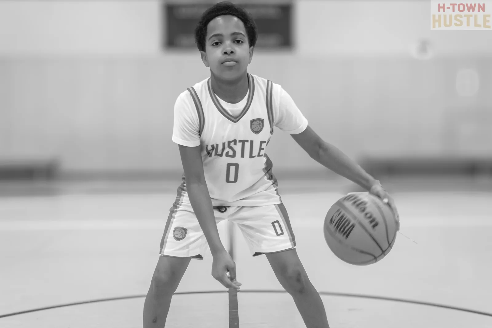 Black and white photograph of a H-Town Hustle player dribbling